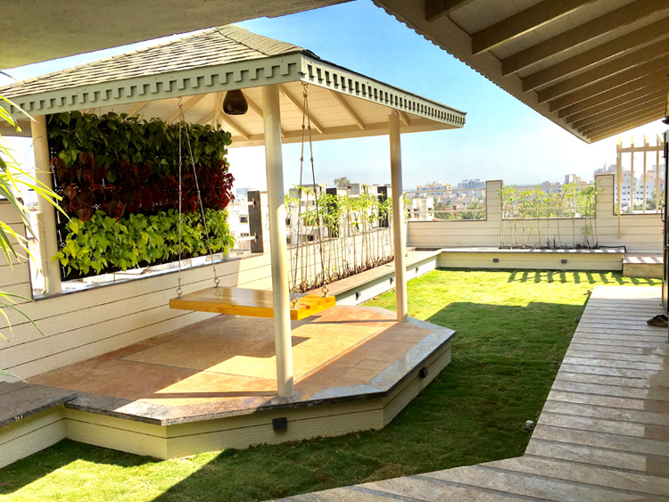 Rooftop terrace with natural lawn and outdoor seating area